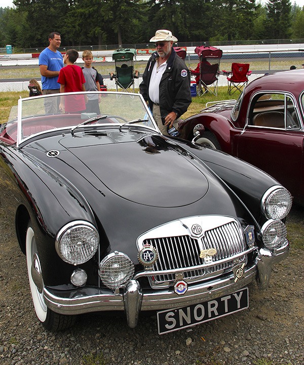 Jack Berg puts on another layer of shine on his 1956 MGA convertible.