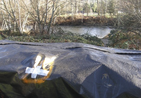 Vandals have left their mark on flood barriers along the Green River