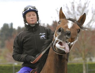Jockey Jennifer Whitaker takes Wasserman out for a run earlier this week at Emerald Downs. Whitaker guided the super gelding to four stakes wins last year