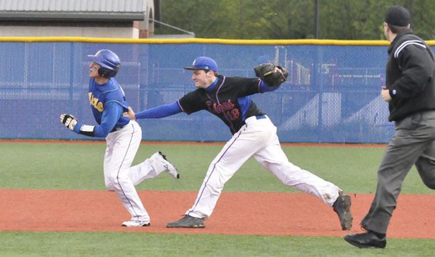 Auburn Mountainview's Steven Johnson tags out Hazen baserunner Eric Jacobs during the Lions' 3-1 win.