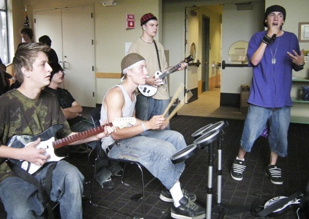 Teens compete in a rock band tournament last year at the Auburn Public Library. Music is a big part of this year's Teen Read Week.