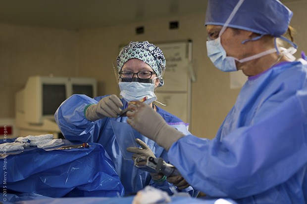 Auburn’s Emily Dunham works with plastic surgeon Dr. Tertius Venter