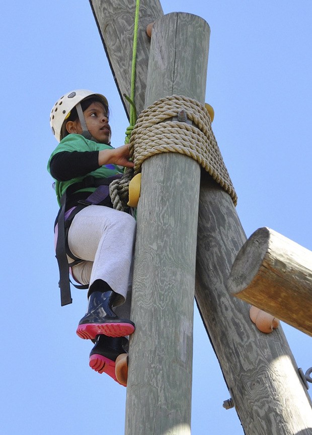 Aaliyah Corbett climbs the wall during last year's Healthy Kids Day at the Auburn Valley Y.