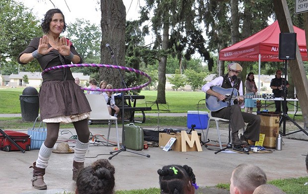 Nala Walla and Keeth Apgar as The Harmonica Pocket group perform on stage at Les Gove Park.