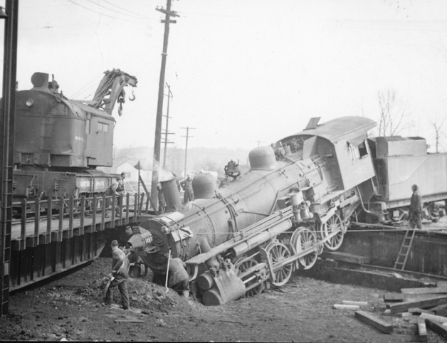 Photographer Al Farrow captured this image of a Northern Pacific locomotive off the rails at the Auburn roundhouse pit during World War II.