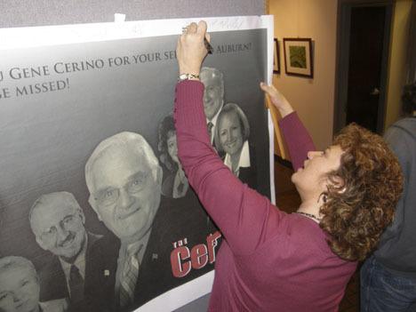 Auburn City Councilmember Nancy Backus joins others in signing a farewell poster for outgoing City Councilmember Gene Cerino.