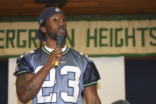 Seahawks defensive back Marcus Trufant talks to students at Evergreen Heights Elementary School