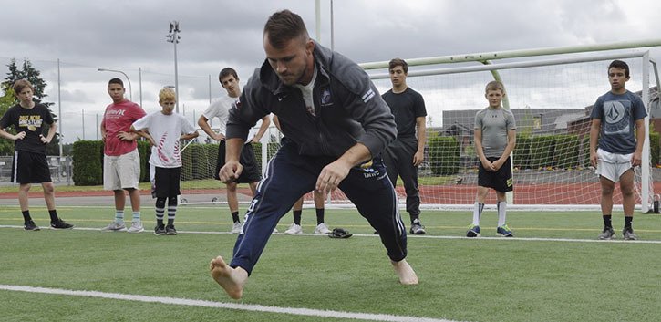 Three-time state wrestling champion Michael Mangrum has returned to Auburn to guide young grapplers in a camp that runs through Aug. 19.