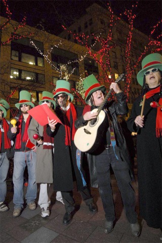 The Llewellyn family (aka the Llew Crew) performs a spiced-up version of a Christmas carol during last year’s Great Figgy Pudding Street Corner Caroling Competition in downtown Seattle. This year’s contest takes place 6 to 8:30 p.m. Dec. 5