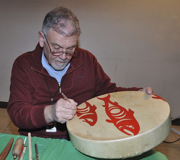 Greg Watson colors Native American art during the Green River College Foundation benefit for the Interurban Center for the Arts.