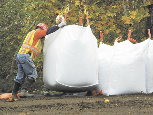 Crews positioned giant sandbags along the Green River to reinforce certain levees back in 2009.