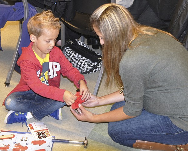 Zhanna Tsvor helps her son David