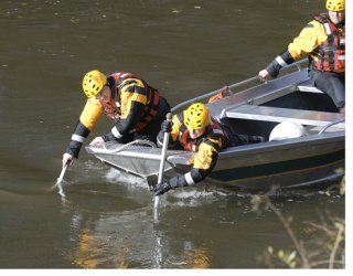Members of the King County Sheriffs Marine Dive Unit searched early this week for the car that went into the Green River with two boys. The car was located and eventually pulled from the river Tuesday