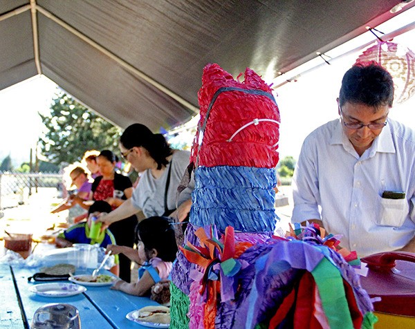 Attendees fill their plates with traditional Latino food during the Auburn Valley YMCA's Latino Festival.