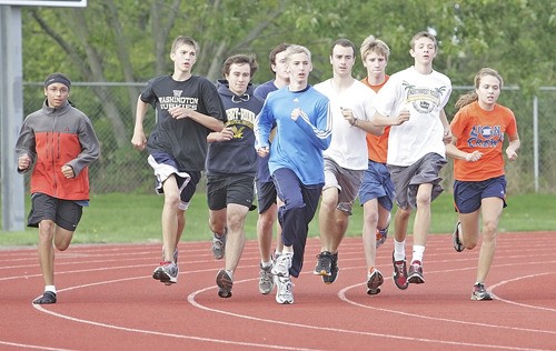 The Auburn Mountainview cross country team trains at the high school's track.