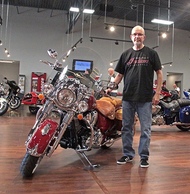 Spike Addis likes the Indian motorcycle’s many great features. Addis is the head salesman of Indian motorcycles at the newly-opened Indian and Victory dealership on West Valley Highway.