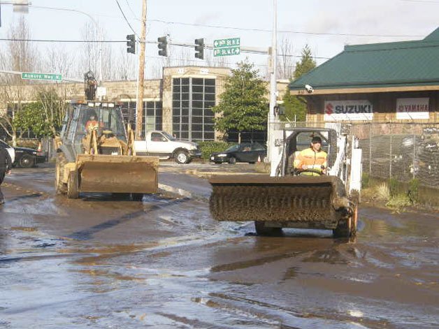City crews clean up the muck on 8th Street Northeast