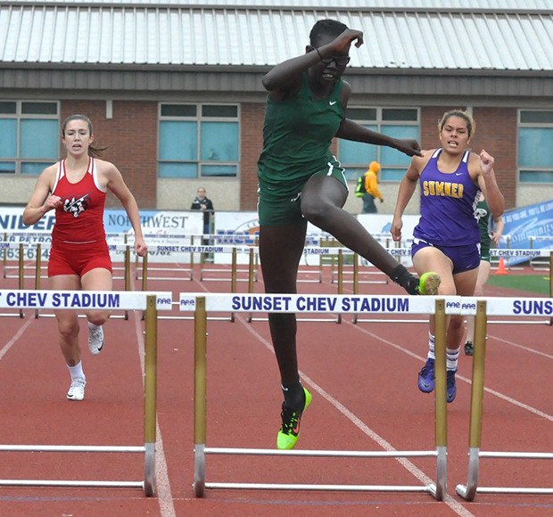 Auburn's Rebecca Thareek wins the 300-meter hurdles in 45.61 seconds at Saturday’s Class 3A West Central/Southwest bi-district track and field meet in Sumner.