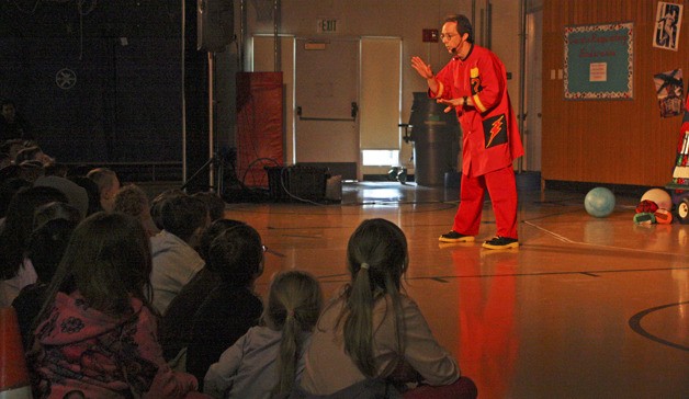 Performer Rhys Thomas wows the crowd at Washington Elementary last Saturday with his educational