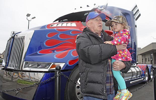 Kent's Mike Somerville holds his granddaughter