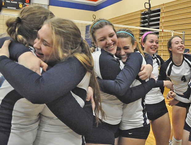 The Ravens celebrate their district title after a come-from-behind victory over Columbia River on Saturday.