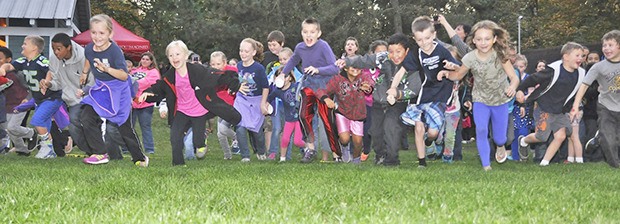 Kids participate in a candy scramble hunt during the S’more Than You Imagined event at Game Farm Wilderness Park. The Auburn Parks