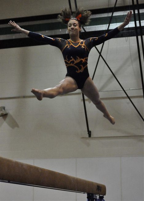Auburn Mountainview's Lexi Morton soars above the balance beam at the South Puget Sound League/Narrows/Olympic/West Cascade Conference 3A sub-district at Kentwood this past Saturday. In addition to winning the beam with a 9.425