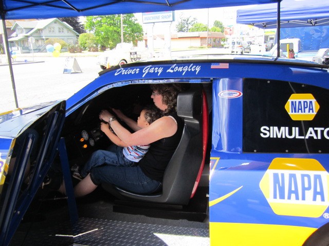 Bryce McGee and LuAnn Young-Bontempo take the Nascar Simulator for a spin.