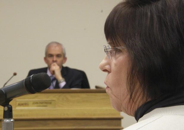 Auburn Financial Director Shelly Coleman presents the costs of possible annexation of Pacific to the City of Auburn. City Councilmember John Partridge listens intently.