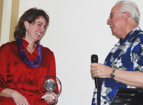 Julie Brewer shares a laugh with Mayor Pete Lewis after accepting the City of Auburn Employee of the Year award for 2009.