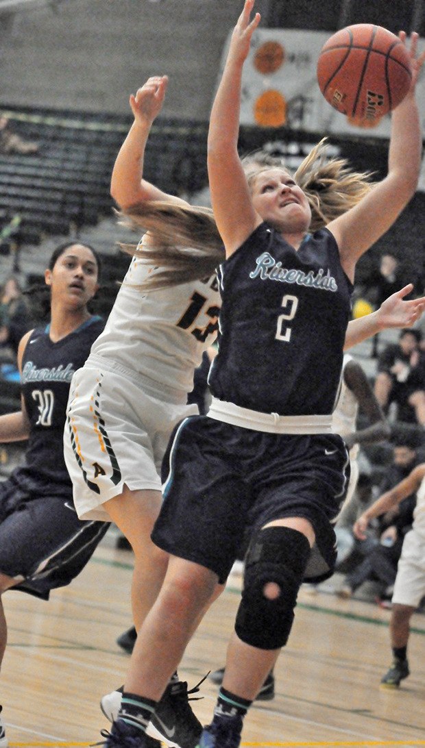 Auburn Riverside's Brooke Dye drives to the basket.
