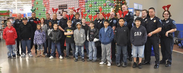 Auburn police officers went shopping with deserving kids at Walmart last weekend.