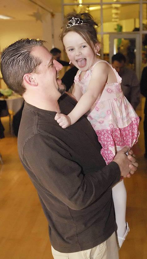 Ty Elkinton shares a laugh and a dance with his daughter