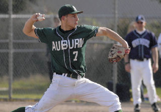 Auburn senior pitcher Colton Brown prepares to let one fly during last Friday’s 16-strikeout performance against Auburn Riverside. Brown struck out the side in the third