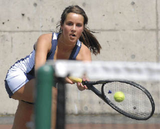 Auburn Riverside’s Carly Holtgraves stretches for a shot during last Friday’s SPSL 3A girls doubles title match. Holtgraves and Caroline Craft defeated Auburn’s Peyton Prothero and Mariah Siemion