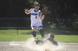 Auburn Riverside’s Hannah Melick (5) puts the tag on Enumclaw’s Devan Borgen during last Saturday’s district semifinal game. Melick and the Ravens went on to a 3-0 victory before falling to Timberline in the finals