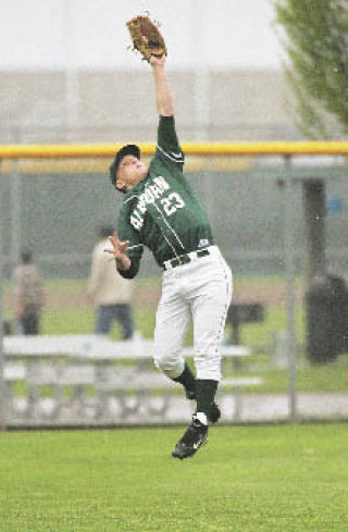 Garrett Rutledge makes an acrobatic catch in left field during Auburn’s playoff game against Hazen in May.