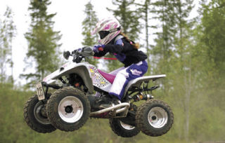 Brittany Schreiber of Auburn goes airborne on her mini quad. Last year