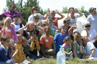 Getting ready to take a group photo are the Auburn YMCA Summer Day Camp Kids and volunteers and donors with the Partners With Youth campaign. The recent event was a thank-you cookout at the YMCA for the campaign