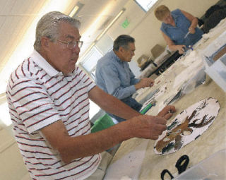 Bob Merriman works on his stained glass stepping stone of a deer. It was all part of the ‘Seniors Making Art’ stained glass stepping stone class at the Auburn Senior Activity Center. The stepping stones often are used in gardens