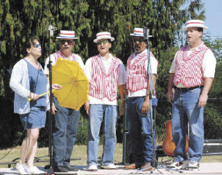 A barbershop quintet performs during the Holy Family Catholic Church’s recent centennial parish picnic. The Sept. 7 celebration included entertainment from the church’s music ministry and Sacred Heart community and an introductory address from the parish’s new pastor