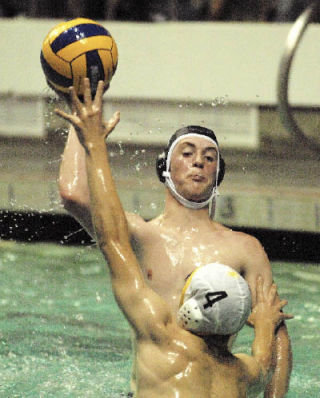 Auburn Riverside senior Kyle Rogers elevates over an Enumclaw player during an Oct. 7 water polo match.