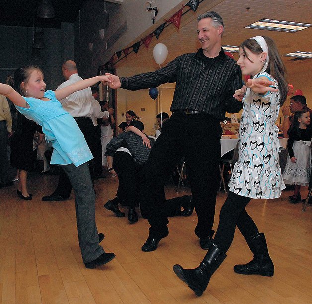 John Ruppert dances with his daughters Katie