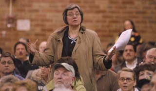 Concerned citizen Patricia Helmer poses a question at the community meeting with the U.S. Corps of Engineers.