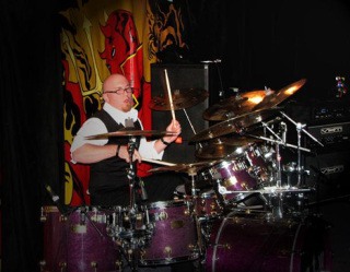 Tory Mayfield performs on the drums for the band