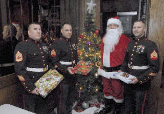 Members of the U.S. Marine Corps joined Santa at the Iron Horse Casino to collect donations for the Toys For Tots program. From the left are: Gunnery Sgt. William Whitaker