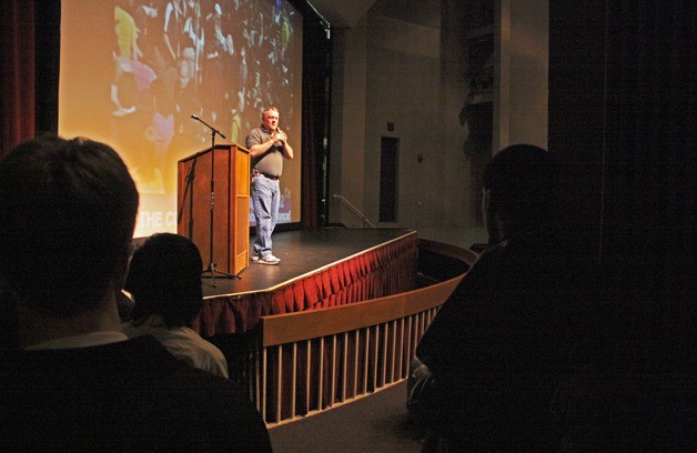 FIRST Robotics spokesperson Kevin Ross speaks to the crowd at the Auburn Performing Arts Center to kick off the robotics competition’s 20th season.