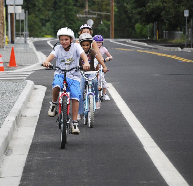 Children ride safely in the bicycle lanes on M Street. The Bicycle Task Force recently wrapped up its work and made a series of recommendations for improvements to the city’s bike routes.