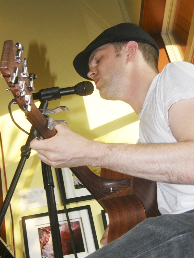 Harold Crisman plays a tune at Zola’s. The café has become a popular local spot for music.