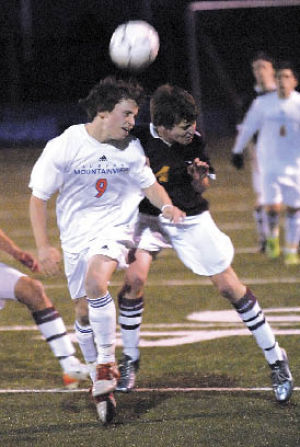 Auburn Mountainview’s Juan Navarro (9) battles White River’s Jerrod Adams for the ball during Wednesday night’s SPSL 3A boys soccer game. White River came away with a 2-0 victory.